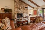 There is a stone-clad fireplace non-operational and a flat screen TV for entertainment